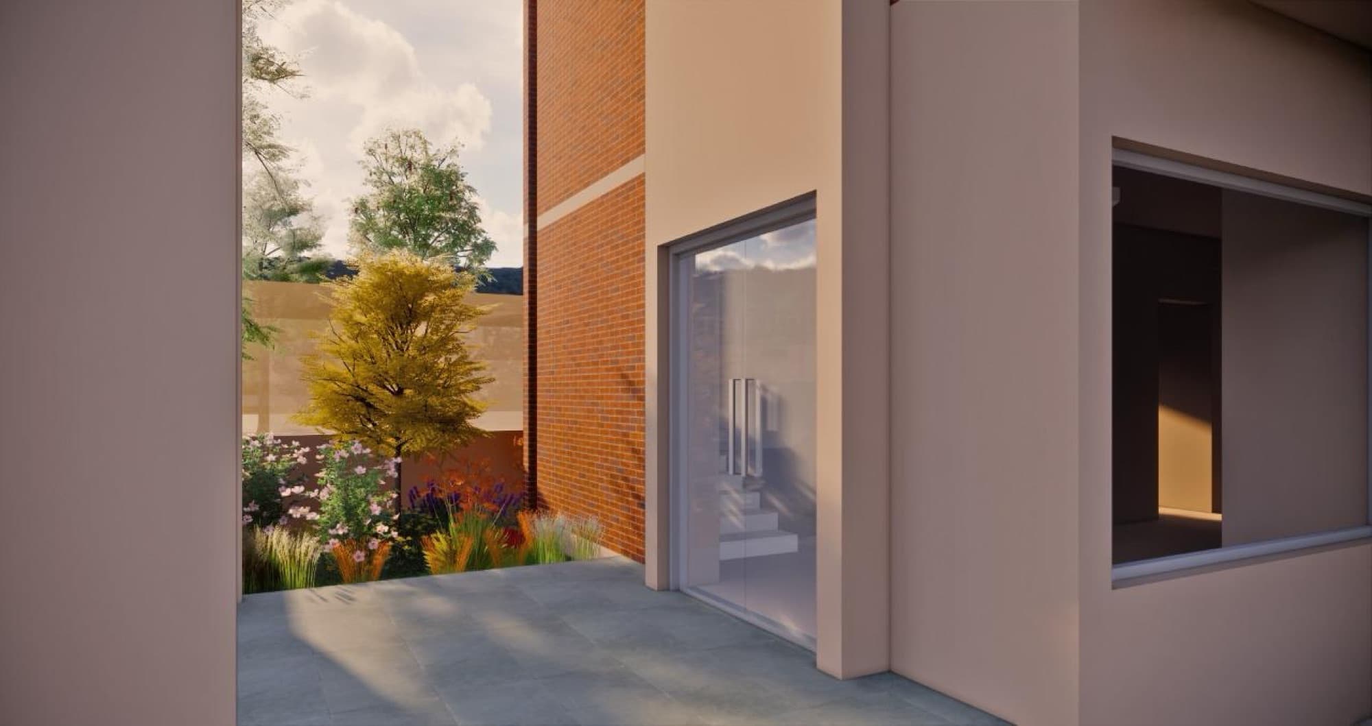 Entry court of the Panchayat Building with exposed brick, planted borders and a glazed entry door