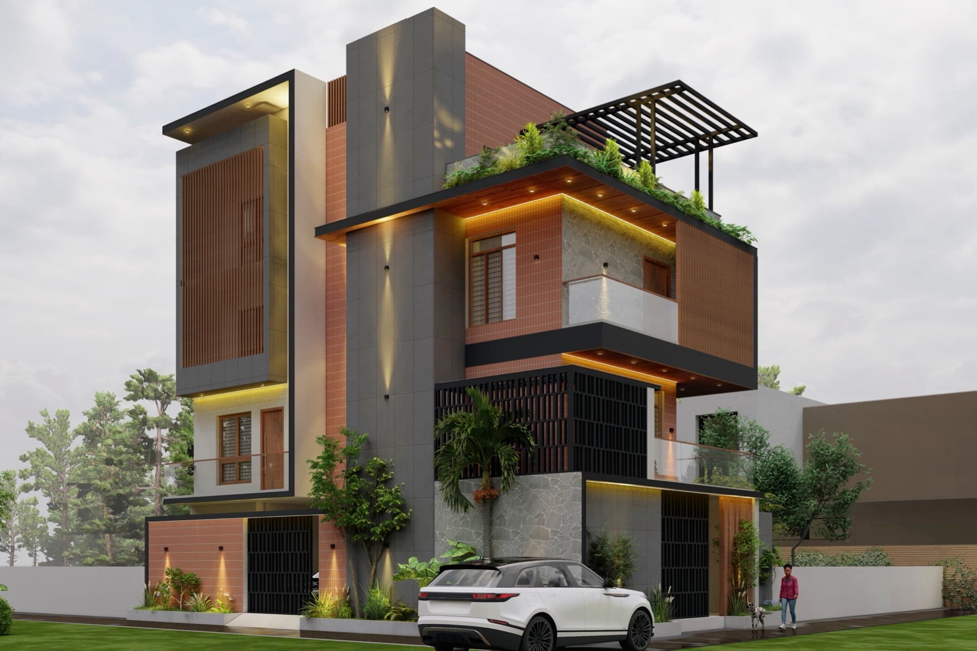 Corner view of the Mulbagal villa with terracotta tile cladding, stone base and a planted roof terrace under a black pergola